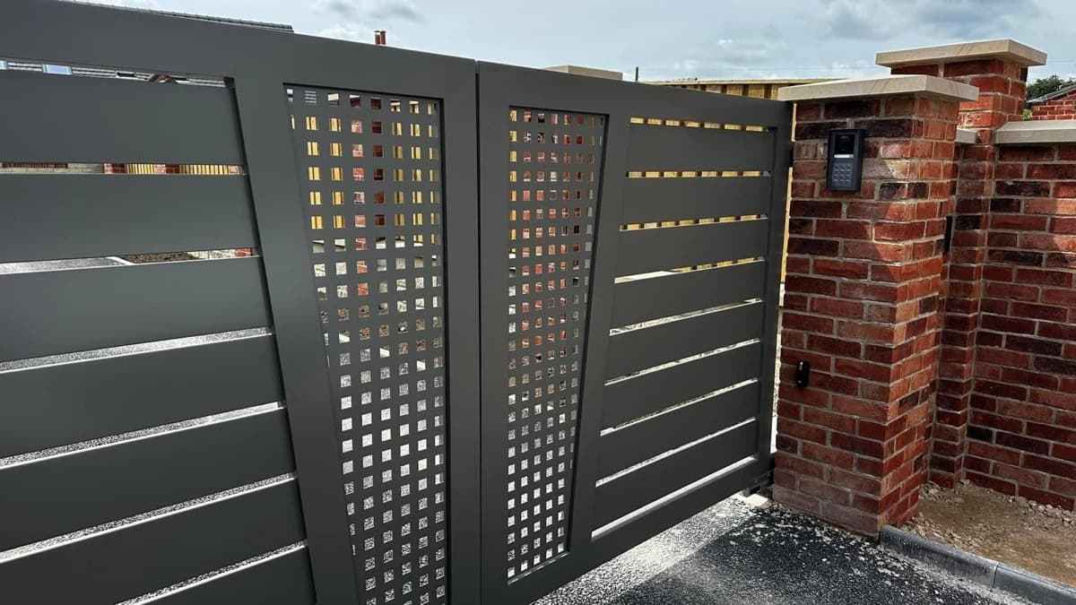 Close-up of modern perforated steel gate detail